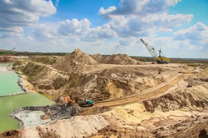 Construction Equipment in Quarry With Water